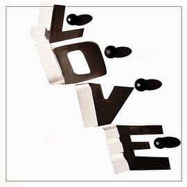 LOVE – with white lettering in shadow and coloured cubes. by Gerhard de Wit