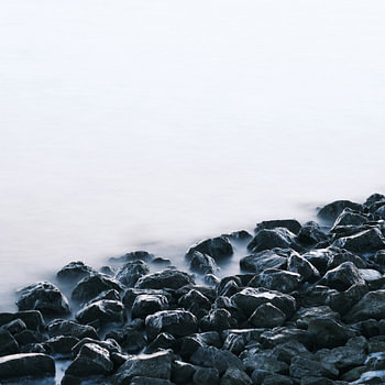 A group of stones making a breakwater together (seascape)