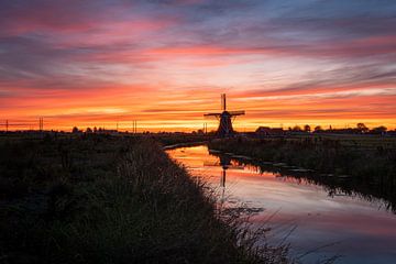 Molen De Jonge Held bij zonsondergang van Arjan Bijleveld