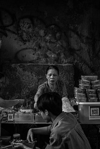 Asian woman having dinner at the market