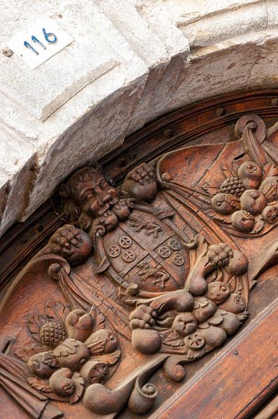 Wooden ornament above door by Wil Wijnen