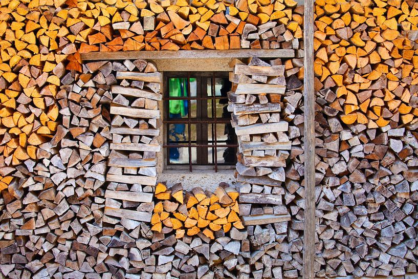 A pile of wood with a window by Christa Kramer