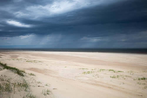 Coastline on vlieland with passing clouds & rain.