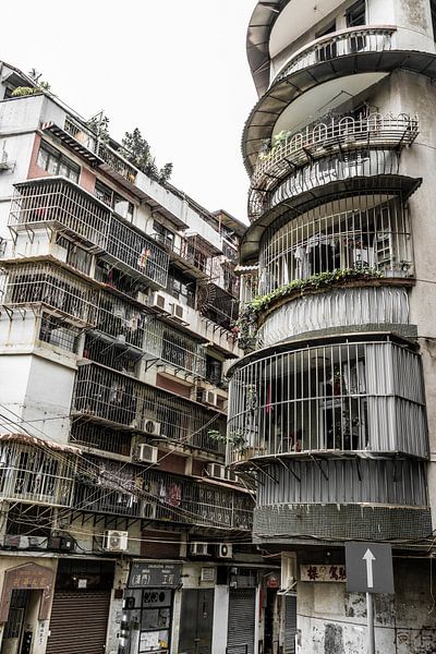 Narrow streets and apartments in Macao by Mickéle Godderis