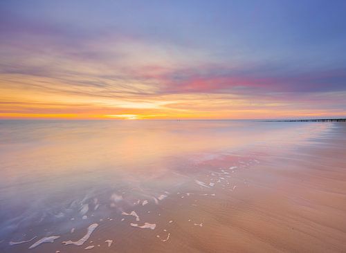 A sunset scene with pastel shades on the beach at Zoutelande, Zeeland