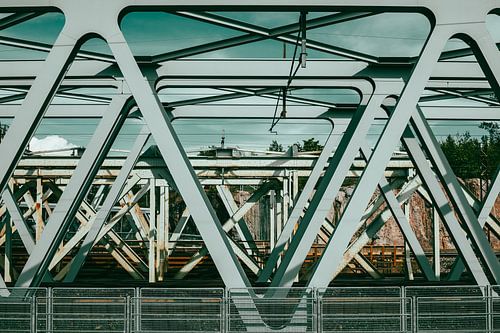 Rhythm of Steel – Interlaced Railway Bridges in Turquoise Light