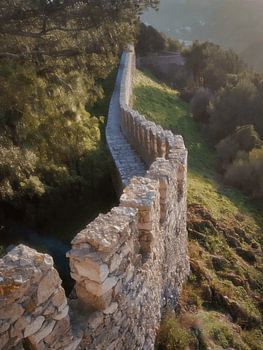 Castle Wall of Castelo de Sesimbra, Portugal at Sunset