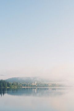 Foggy lake and town in the morning | travel photography in Germany | dark forest photo art print by Milou van Ham