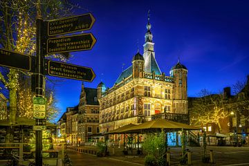 Evening glow on the Brink: De Waag and Wegwijzers in Deventer by Bart Ros