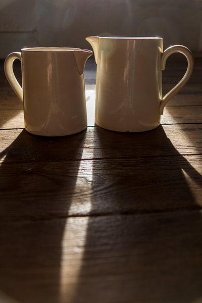 old white earthenware milk jugs by Elly de Vries