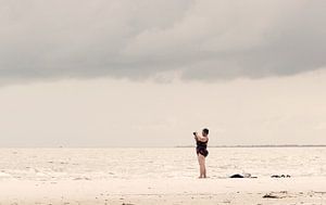 Woman on beach von Kim Verhoef