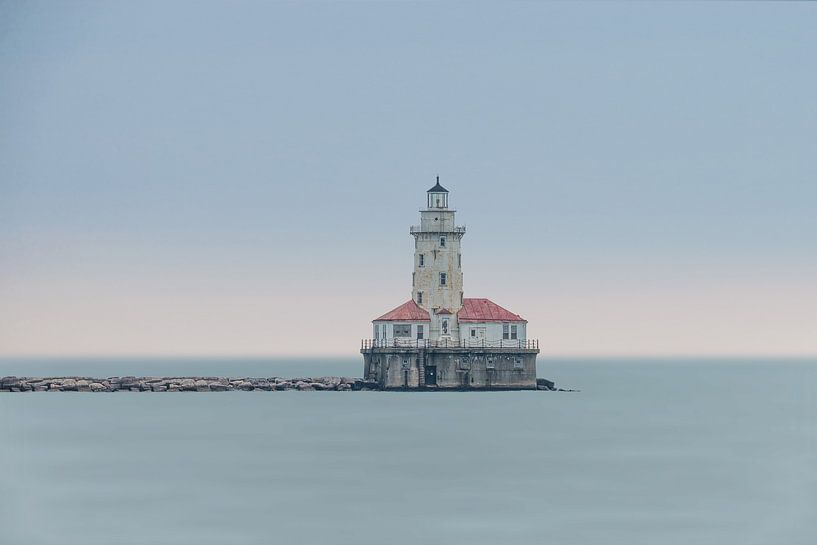 Lighthouse in the water at the end of a breakwater by Jille Zuidema