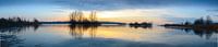 Sunset over a lake with small islands at the end of a winter day by Sjoerd van der Wal Photography thumbnail