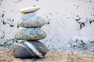 Zen pile of stones and boulders with an old background by Trinet Uzun thumbnail
