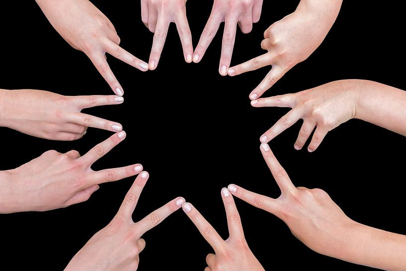 Ten hands of girls form a star isolated on black background by Ben Schonewille