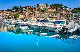 Boats at harbor of beautiful city Port de Soller at coast of Mallorca island, Spain