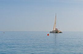 Little Sailboat on the Calm Ocean before Malaga  von Sebastian Czech