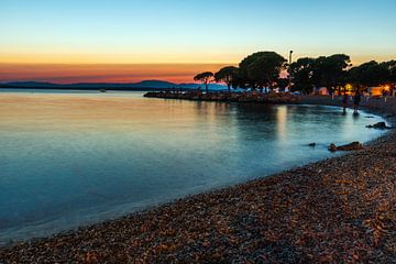 Coucher de soleil sur la plage de Croatie sur Mustafa Kurnaz