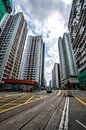 Hoogbouw bij de tramsporen in Hong Kong van Mickéle Godderis thumbnail