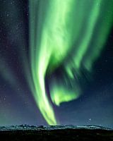 Northern lights over the mountains in Iceland