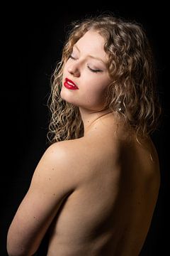 Studio Portrait of a 21 year old white blonde woman showing her 