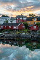 Reflective sunsets and characteristic houses on the Lofoten