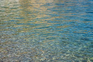 Clear sea water and reflections on the beach by Adriana Mueller