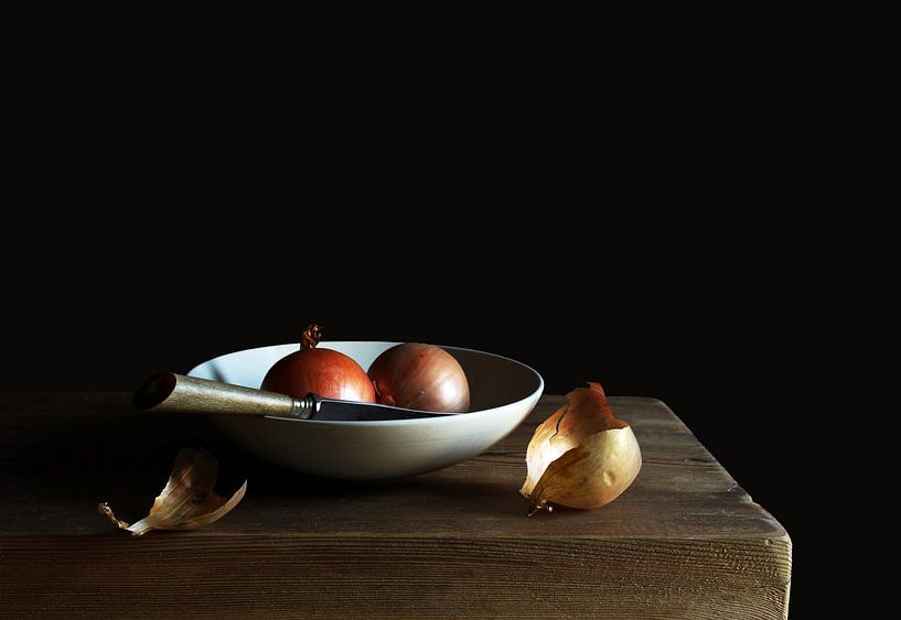 Onions with knife in white bowl by Ton Meijer