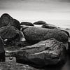 Stones on the shore of the sea by Frank Herrmann