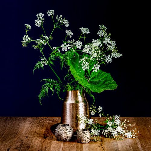Still life of pennywort in copper pot on wooden tray