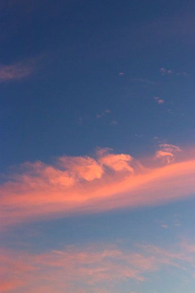 Colourful pink clouds in the blue sky | South Holland | Netherlands | Travel photography print by Kimberley Helmendag