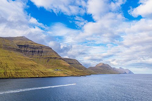 View of the rocks of the Faroe Islands with clouds