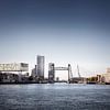Rotterdam cityscape with De Hef on the left and the Erasmus bridge on the right. by Tjeerd Kruse