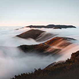 An ocean of clouds over the mountains in Madeira by Patrick van Os