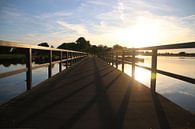 Zonsondergang achter de brug  van Raymond Hofste thumbnail