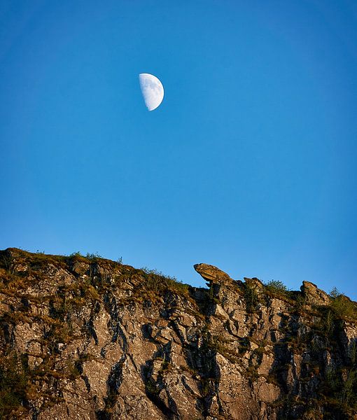 The moon with a view on the Johan Skytt rock on Godøy, Norway by qtx