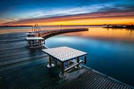 Outdoor swimming pool with jetty at sunrise by Fotografiecor .nl thumbnail