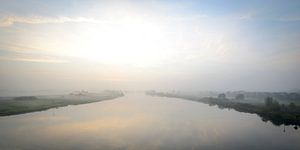 Sunrise over the river IJssel during a beautiful fall morning