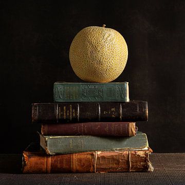 stilleven met oude boeken en een meloen van bob van den berg