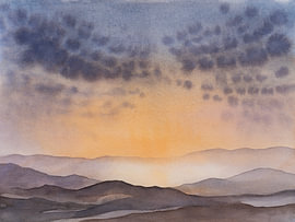 A peaceful sunrise behind the mountains