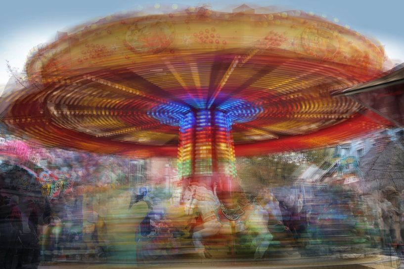 Children carousel in motion at a Christmas fair, multiple long e by Maren Winter