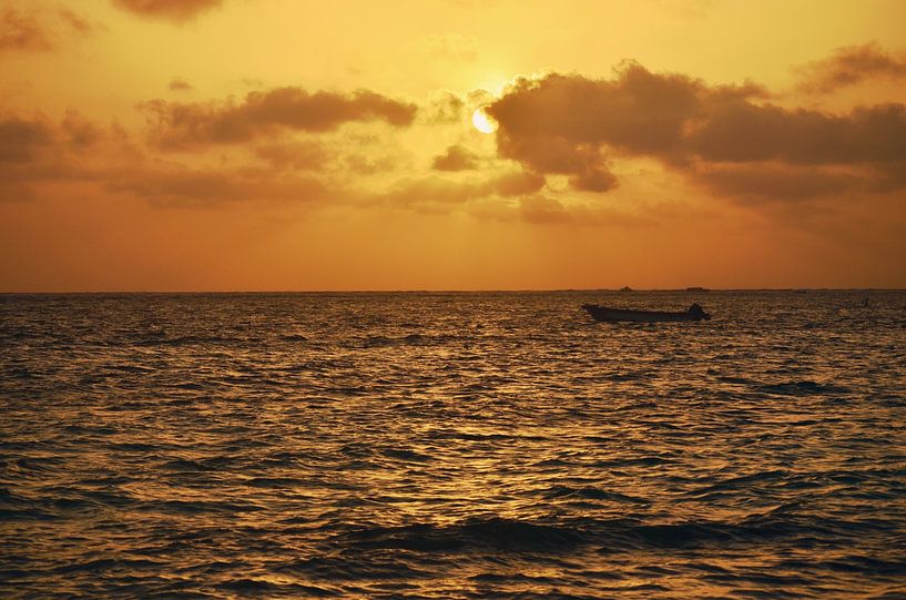 Boat in the sea at sunset by Carolina Reina Photography