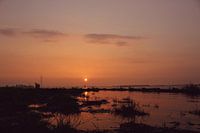 Zonsondergang bij het water