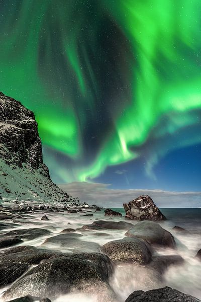 Aurora borealis on the beach in Norway. by Voss photography