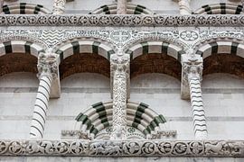 Columned porch of the church San Michele in Foro in downtown Lucca, Tuscany, Italy by Joost Adriaanse