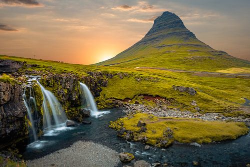 Kirkjufellsfoss waterfall and Kirkjufell mountain in Iceland