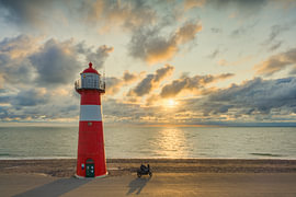The small Westkapelle lighthouse at sunset by Michael Valjak