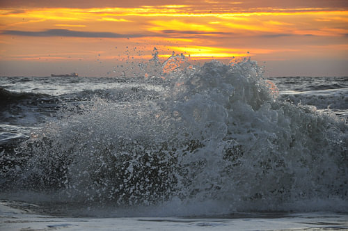 Splashing wave in the sunset