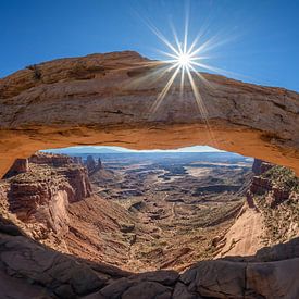 The sun caresses the Mesa Arch in Canyon Lands. by Gerry van Roosmalen