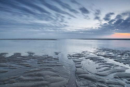 Zonsondergang bij opkomend water